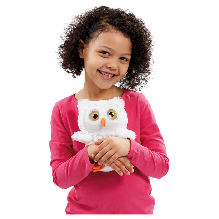 Child girl holding Ani Magic owl toy 