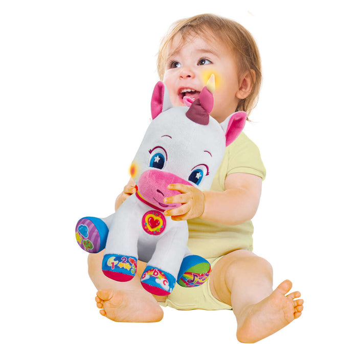 Child hugging unicorn toy 