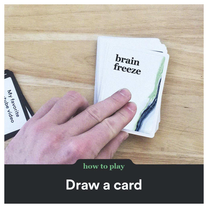 Hand picking up card with brain freeze logo 